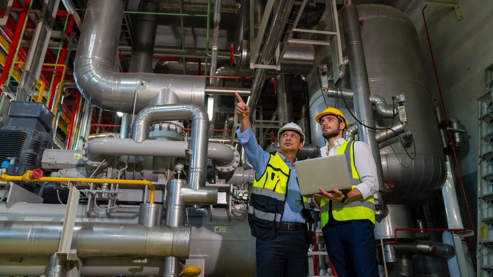 engineers in safety uniforms working