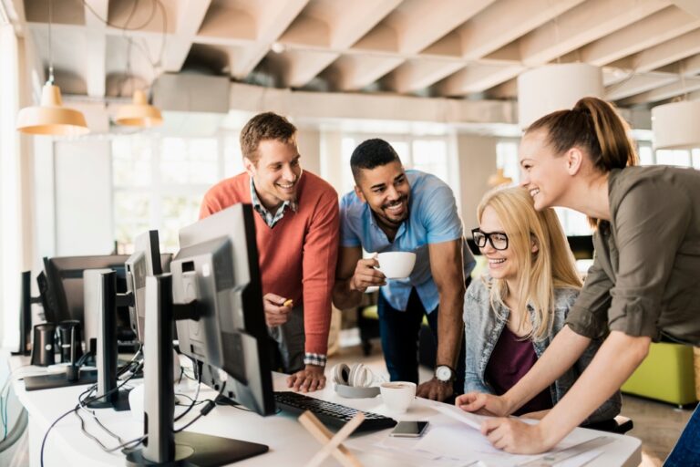 Young and diverse group of engineers working together on a project in a startup company office