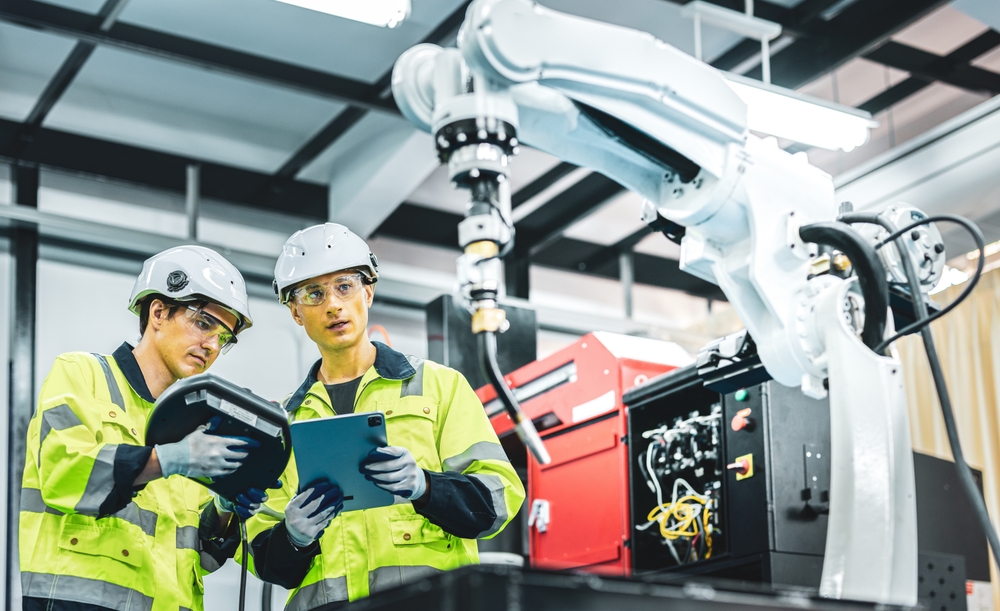 two mechanical engineers observing new engineering technology