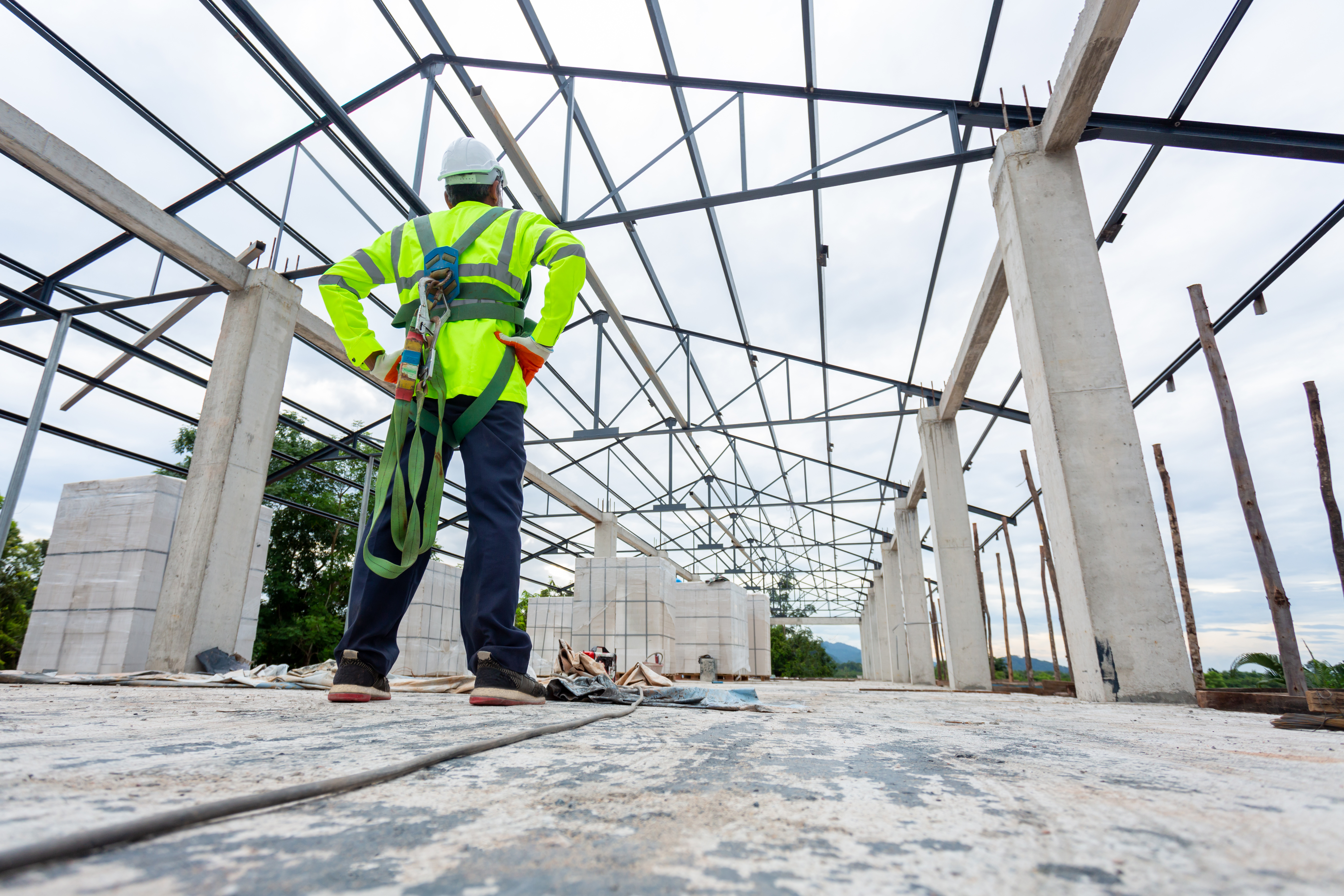 man observing commercial construction job site