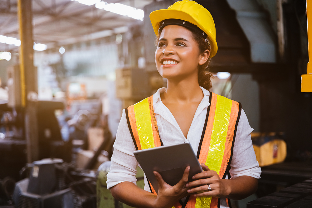 female construction worker holding tablet