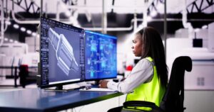 Engineer Doing 3D CAD Model Design On Computer At Factory